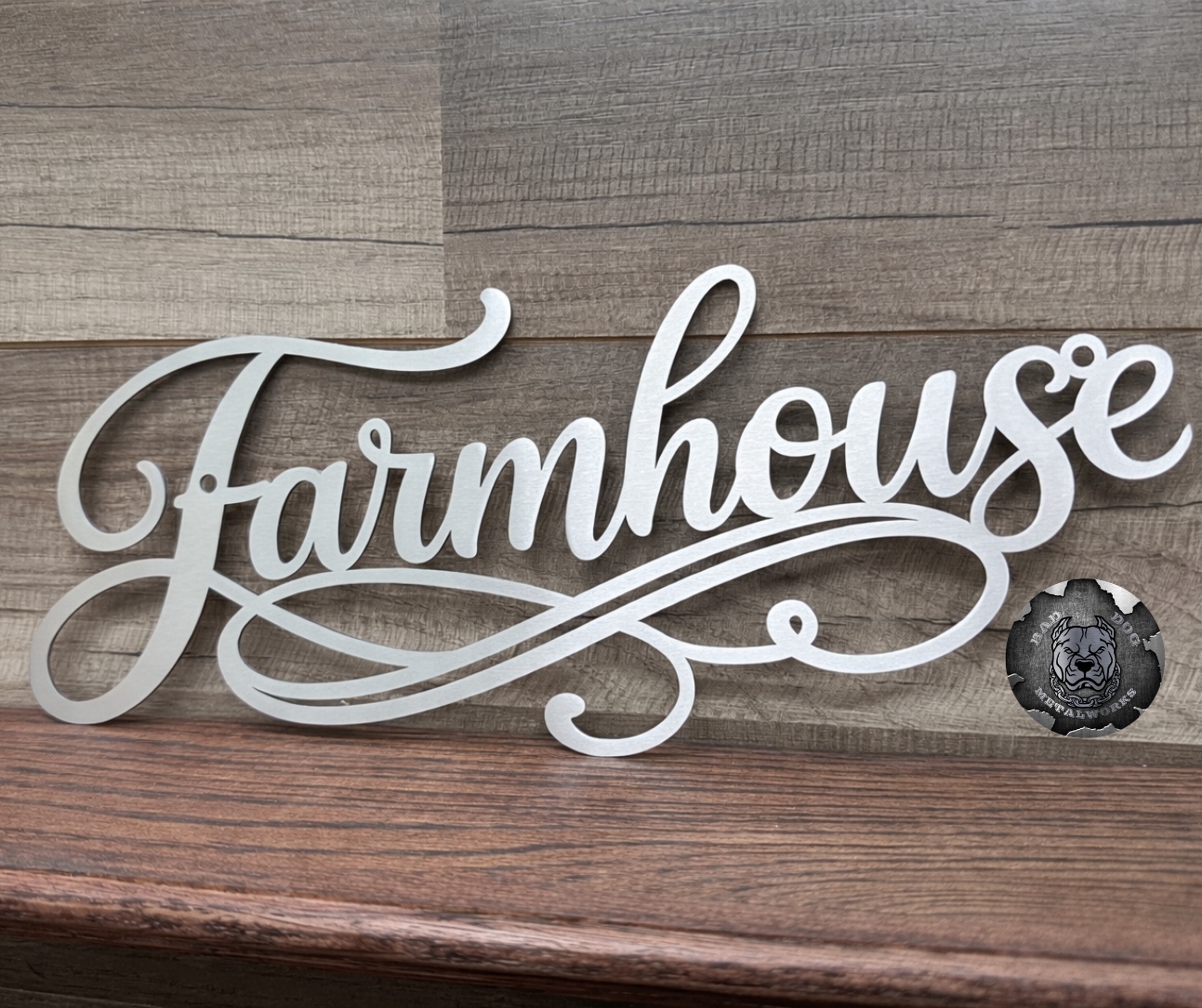 Metal sign with 'Farmhouse' text on a wooden background